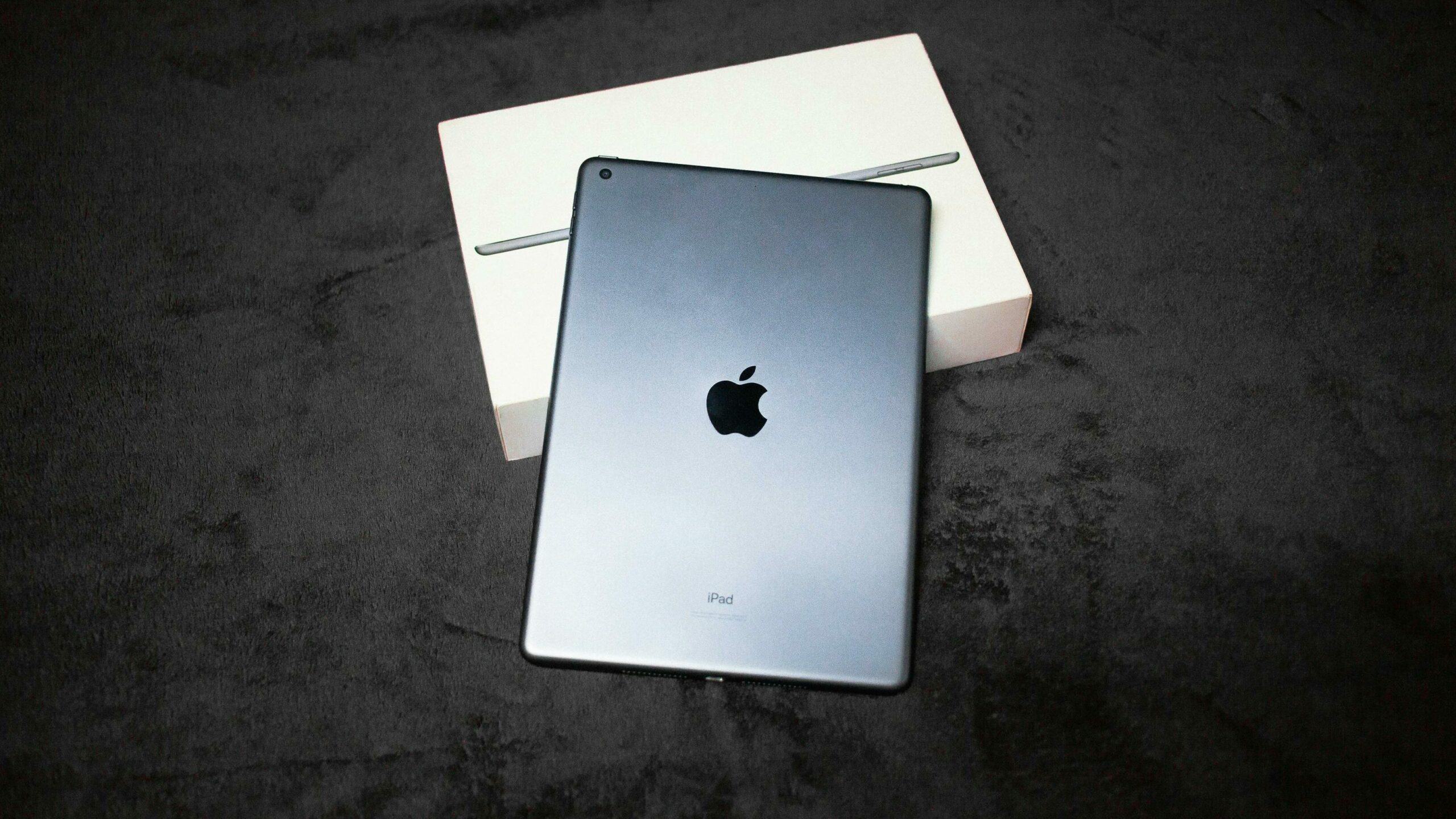 Image of ipad and box for blog post guiding customers to understand when to repair or when to replace
